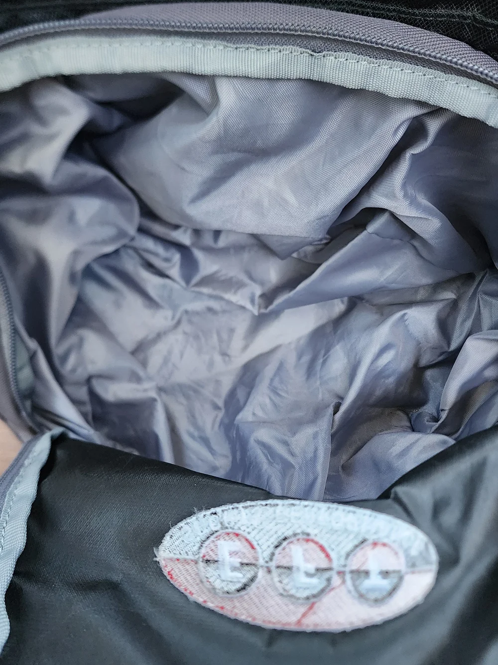 Under Armour Hustle Backpack Black Grey EFT Logo